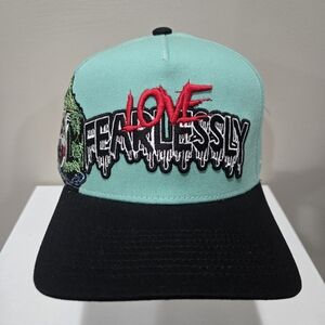 Love Monsters Fearlessly Trucker Hat
